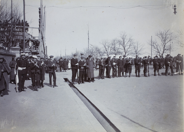 Foreign sailors and volunteers guard a road on the bund during January 1911 riots, Hankow