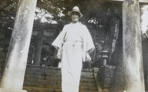 William Armstrong wearing a robe and a hat
