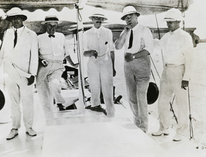 Five European men on a leisure boat