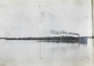 A boat train, led by a steam boat