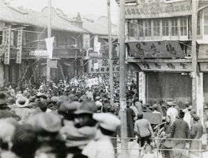 Crowds watching a procession welcoming the Northern Expedition (Nationalist forces), Shanghai, 1927