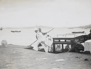 L.C.E. Ayre & D.P. Evans stepping off the boat, 1930