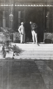 Admiral Sir A. Waistell and Sir Miles Lampson chatting on the steps of British Legation, Beijing