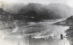Two small junks by the river bank