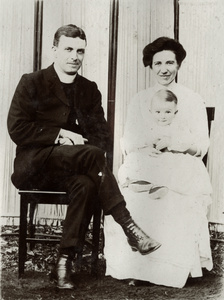 A clergyman with his wife and a baby