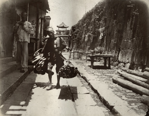 Worker carrying bamboo culms, Changsha