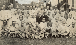 Chinese men with Bishop Banister and another clergyman