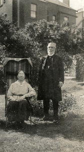 Bishop and Mrs Banister in a garden