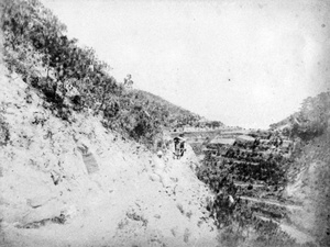 A man on a hillside path