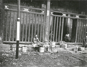 Carriers resting by a temple door