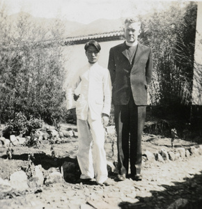 Revd. F.W.J. Cottrell and another man, in a garden