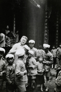 Children interested in Fred Cottrell's camera, Methodist Mission School, Chaotung