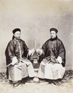 Studio photograph of two Chinese officials