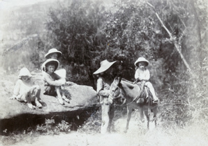 Betsy, Dare,Charles and Bill Elliott, with groom and donkey, Sin-tien-tsi, 1917