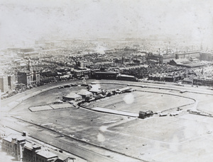 Aerial view of Shanghai Public Recreation Ground showing matshed aircraft hangars