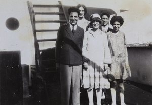 Frank Abraham and his family on board a ship