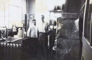 Jack Ephgrave and colleague in chemical room, Pudong factory, Shanghai