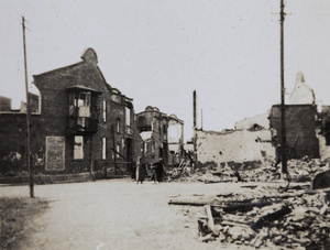 People at a crossroads in war damaged area, Shanghai, 1932