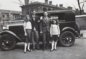 Jack Ephgrave with Olive, Phil and Joan Blown, by a car, Shanghai