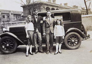 Jack Ephgrave with Olive, Phil and Joan Blown, by a car, Shanghai