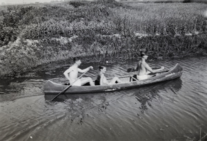 Three men in a canoe