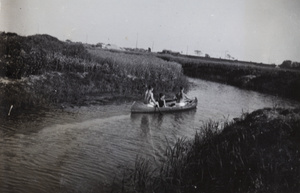 Three men in a canoe, near Shanghai