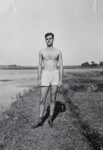 Jack Ephgrave standing on a river embankment