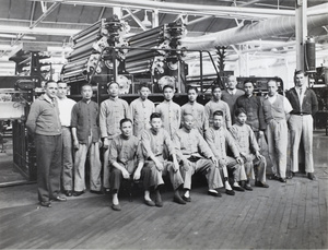 Print workers with large printing press, Capital Lithographers Ltd., Pudong, Shanghai