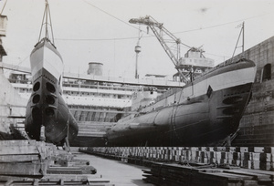 HMS Proteus ('PR') and another submarine in dry dock, beside HMS Medway, Hong Kong