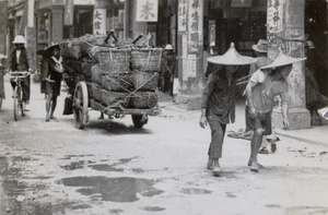 Porters pulling a loaded cart, Hong Kong