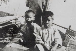Children in a boat, with a box labelled Heinz 'Chow Chow'