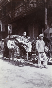 A woman and a child in a rickshaw, Shanghai