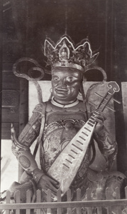 Shrine figure playing a Chinese lute