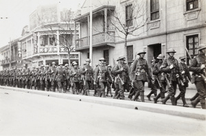 British troops (Shanghai Defence Force) marching along a street, Shanghai