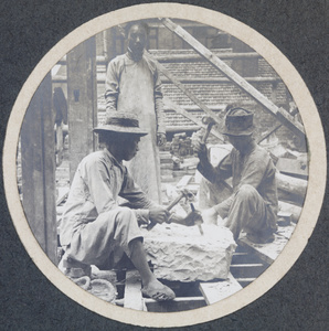 Stone masons and an overseer, working on a building site