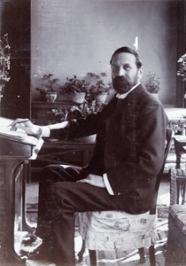 Harry Mason Hillier sitting at a writing desk, Tianjin