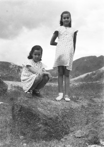 Kristine and Patricia Thoresen on a stony outcrop, near the Army Sports Ground, Mongkok, Hong Kong