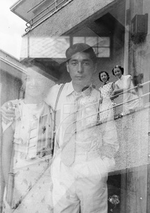 Double-exposed photograph with Lucy and Fred Hutchinson, and Lucy with Helen Ho and another wedding guest on a balcony, Hong Kong