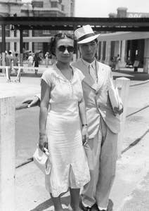 Lucy and Fred Hutchinson, outside the Kowloon Railway Station (KCR), near the Star Ferry pier, Hong Kong