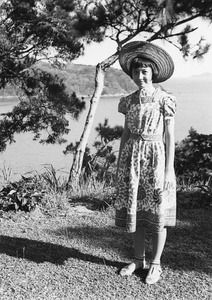 Gladys Hutchinson wearing a staw hat, in an area above 12 Milestone Beach, Castle Peak Road, Hong Kong