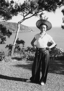Lucy Shirazee wearing sailor trousers, in an area above 12 Milestone Beach, Castle Peak Road, Hong Kong