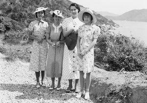 Bea and Gladys Hutchinson on a day trip with Elise Markham and Lilian Thoresen, in an area above a Castle Peak Road beach, Hong Kong