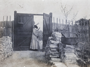 Elizabeth Hutchinson standing inside the gate open to Tongshan Road, Hongkou, Shanghai