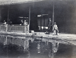 Tourists at a sacred fish pond, Hangzhou