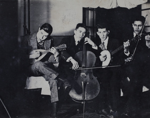 Bill Hutchinson, John Henderson, and two other young men, with stringed musical instruments, 35 Tongshan Road, Hongkou, Shanghai
