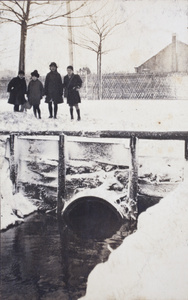 Fred, Maggie and Dick Hutchinson, standing with Nora on a snow covered Tongshan Road, Hongkou, Shanghai, February 1919