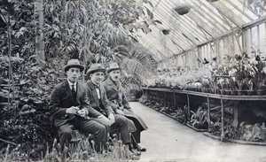 John Piry and Charles Hutchinson with an unidentified man in the Sincere Department Store roof garden, Shanghai