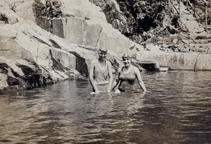 Sarah and Margie Hutchinson, wearing bathing costumes and caps, in an open-air swimming pool, Moganshan