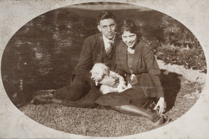 Bill Hutchinson and Mabel Parker sitting together on the garden lawn, 35 Tongshan Road, Hongkou, Shanghai
