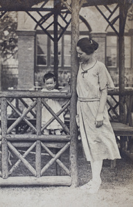 Bea and Sarah Hutchinson standing in the garden summerhouse, 35 Tongshan Road, Hongkou, Shanghai